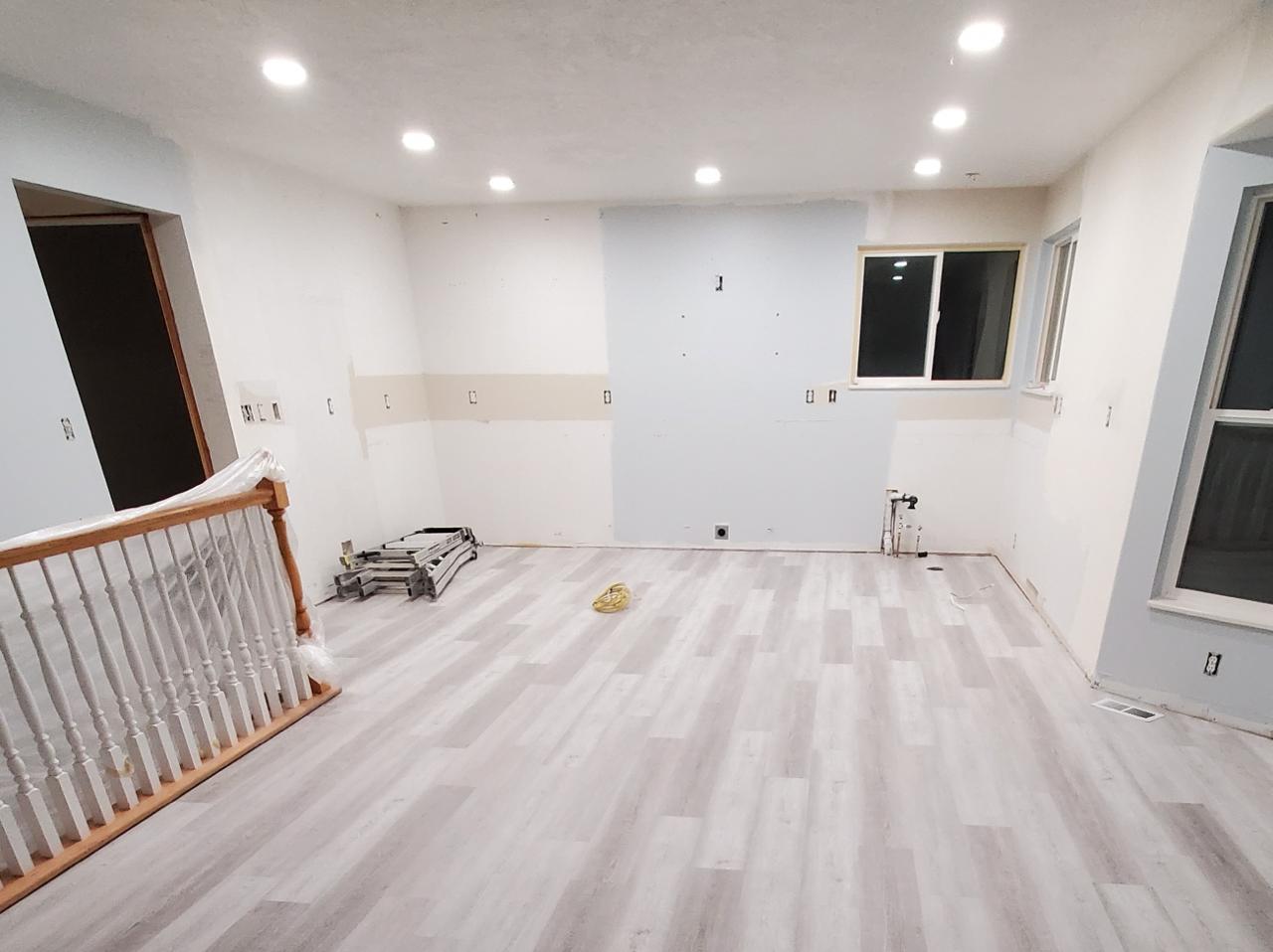 Flooring installation in progress during home restoration - Five Point Restoration crew at work